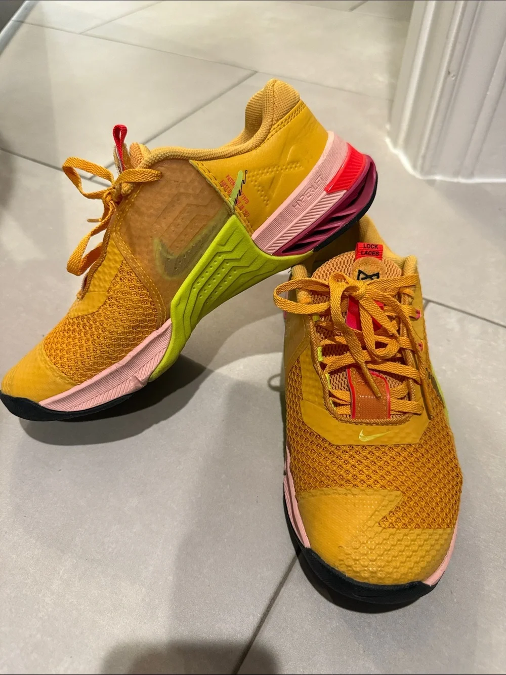 Nike Women's Yellow Running Shoes with Multicolor Sole Accents